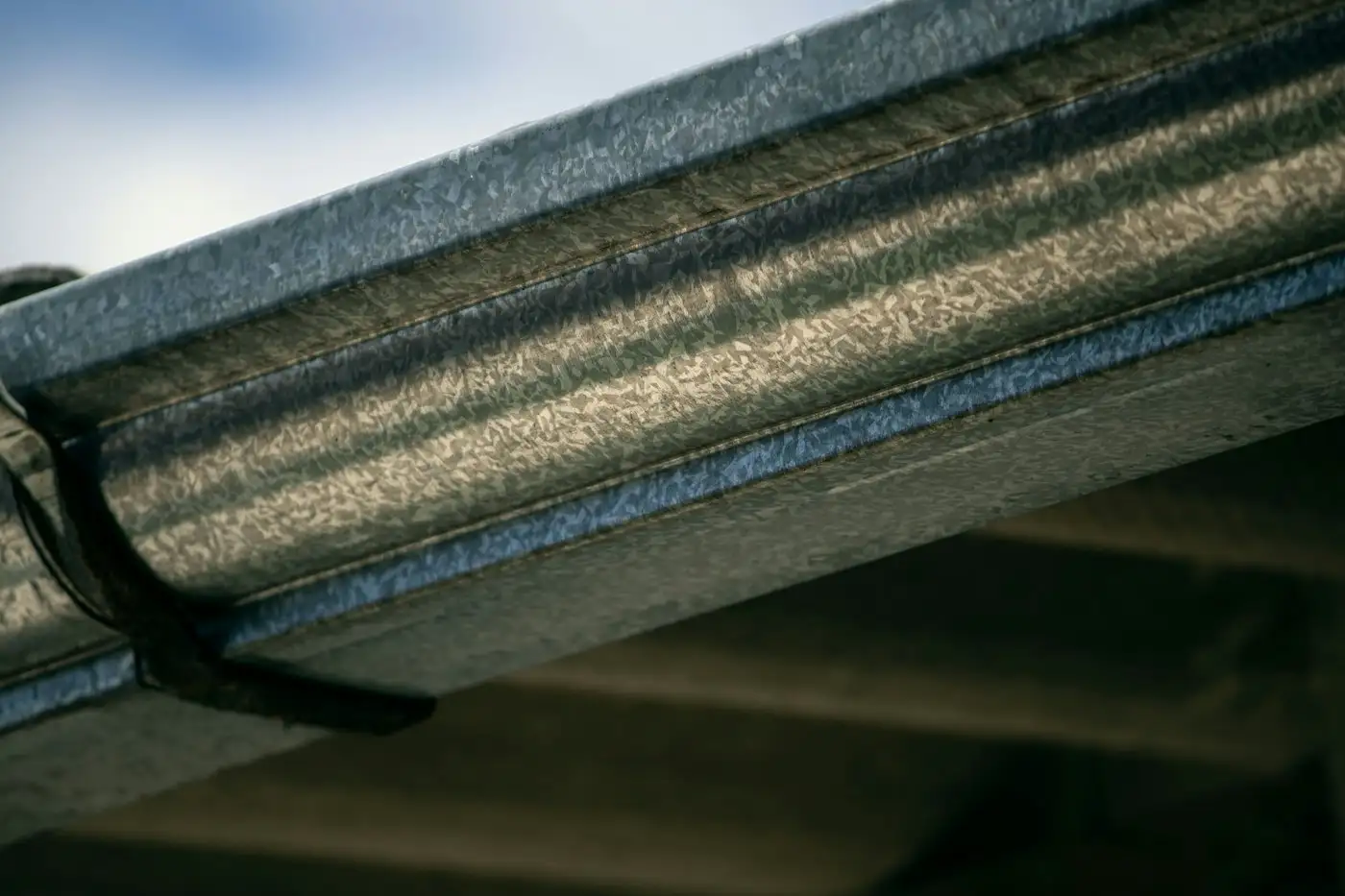 A close up view of a metal gutter