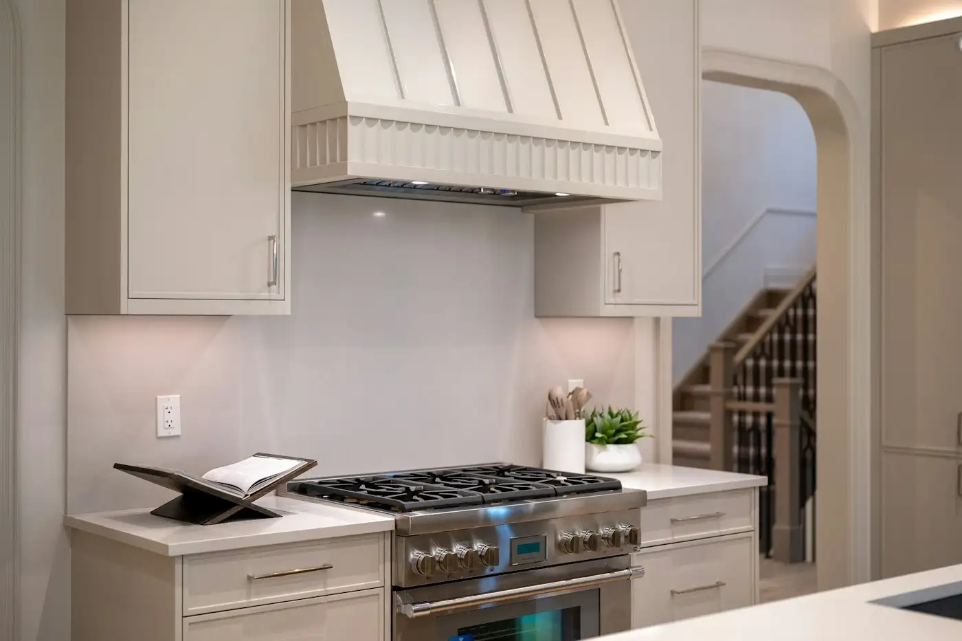 Modern kitchen with stainless steel stove and range hood