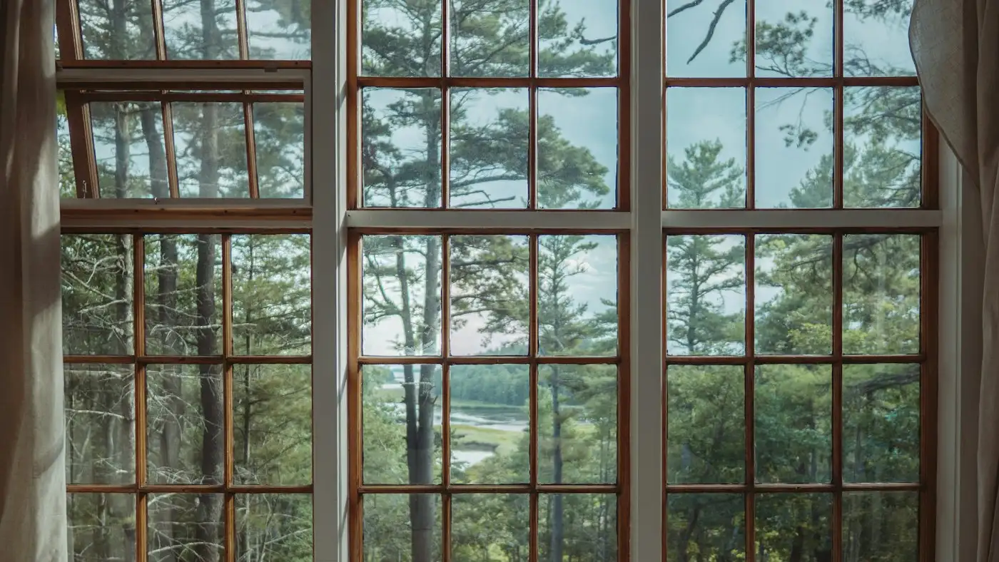 Brown wooden framed glass window