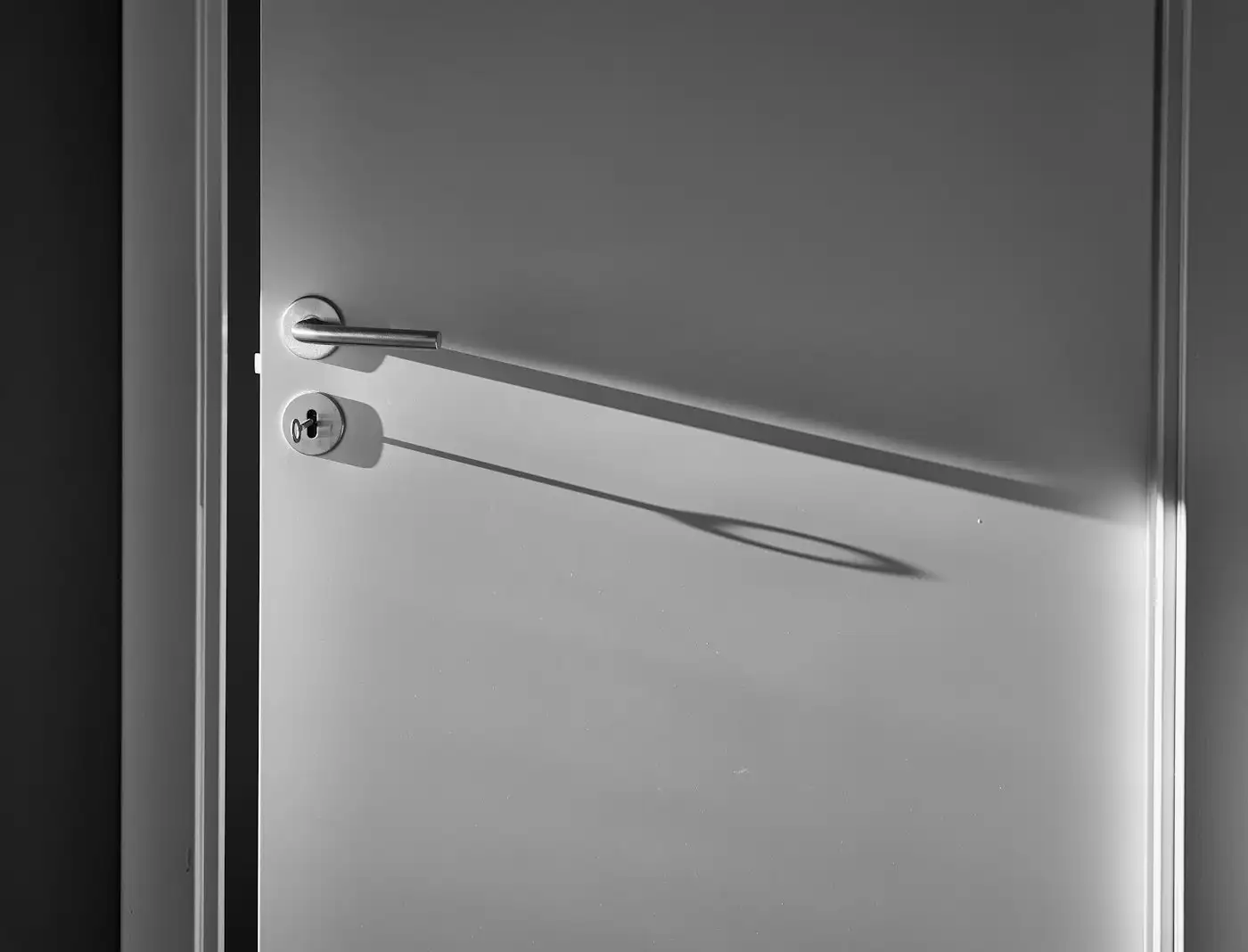 White wooden door with silver door lever