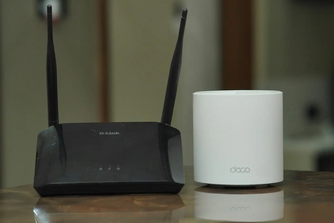 A couple of routers sitting on top of a table