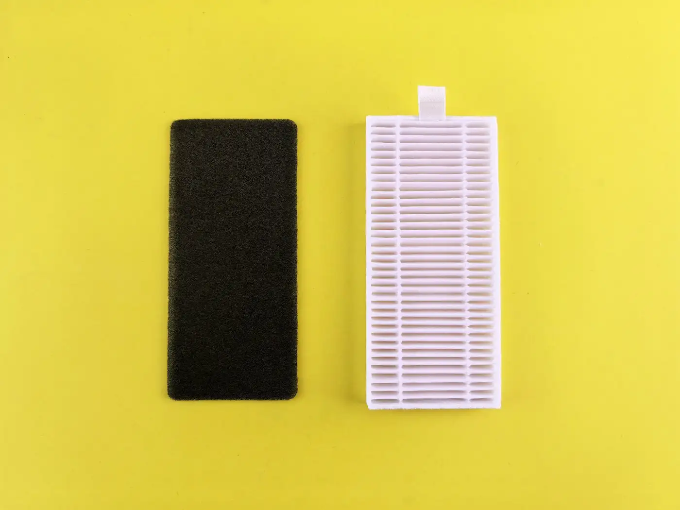 Black filter next to a white filter on yellow background