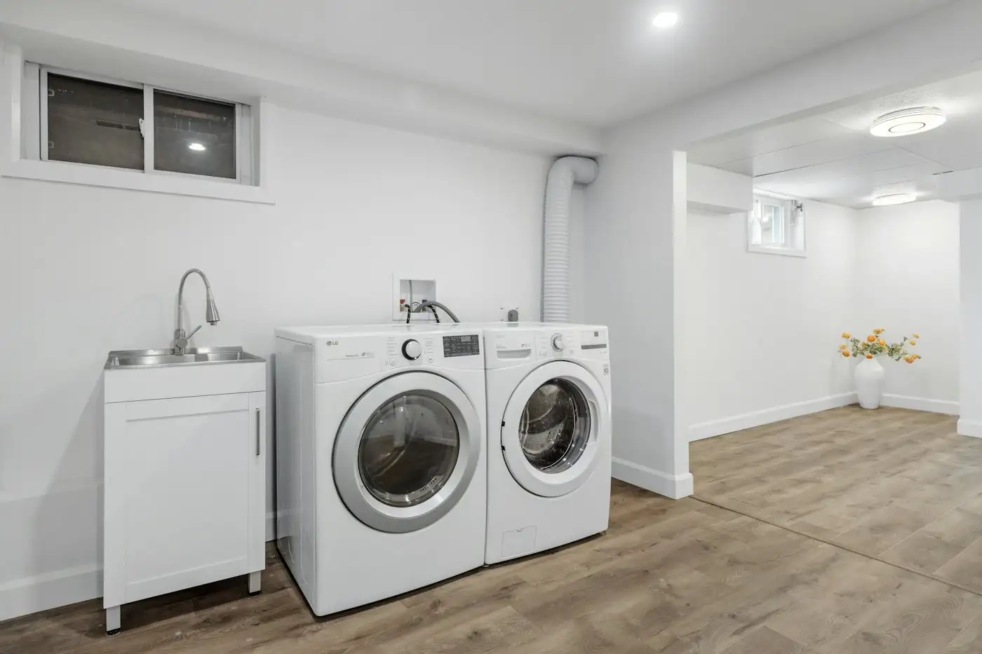 A laundry room with a washer and dryer