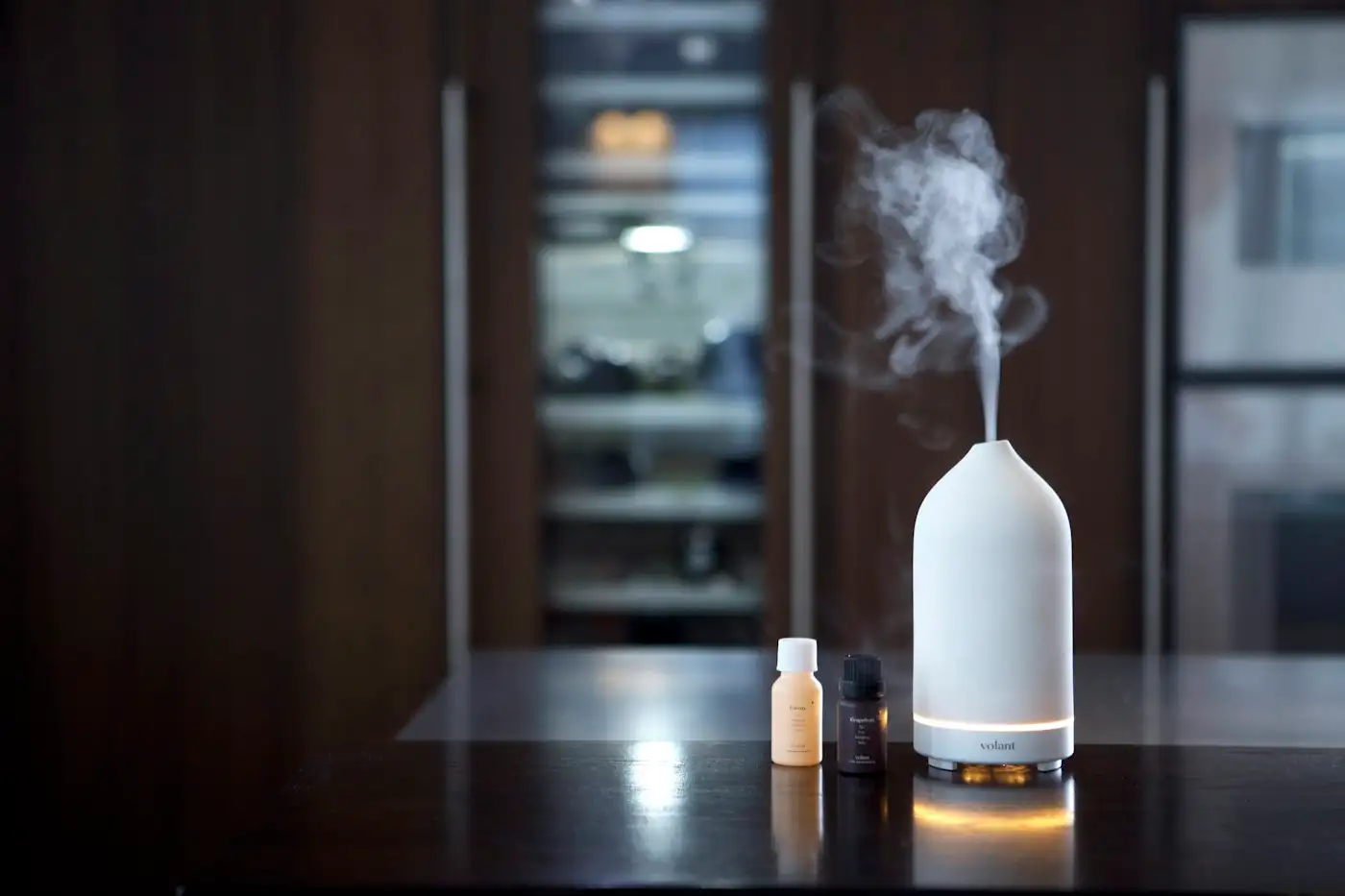 A humidifier sitting on top of a wooden table