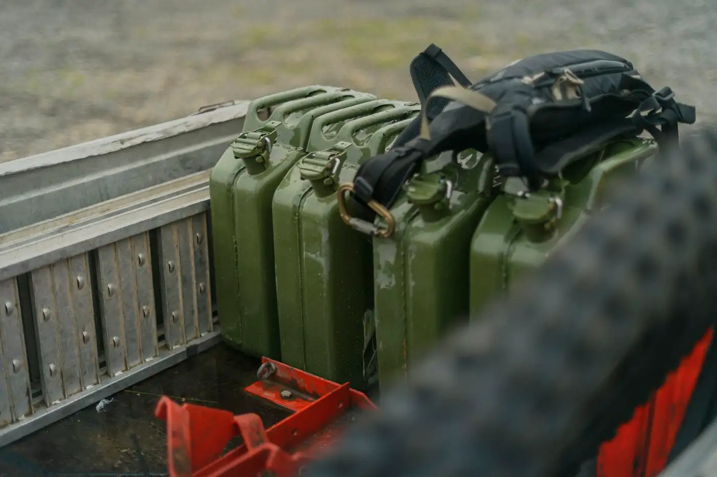 Green fuel cans on truck bed