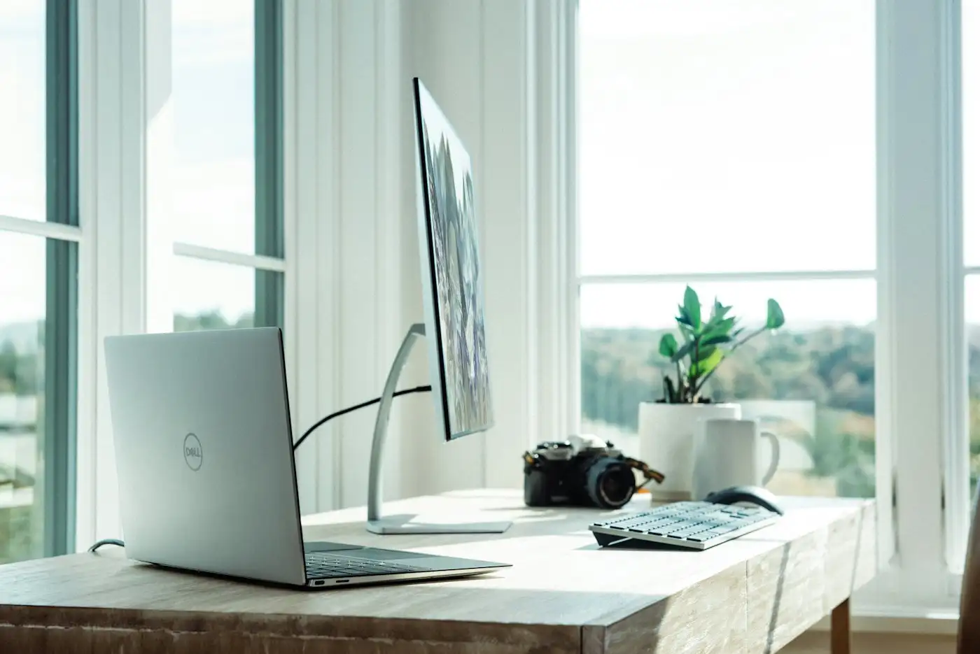 Workspace with laptop and monitor