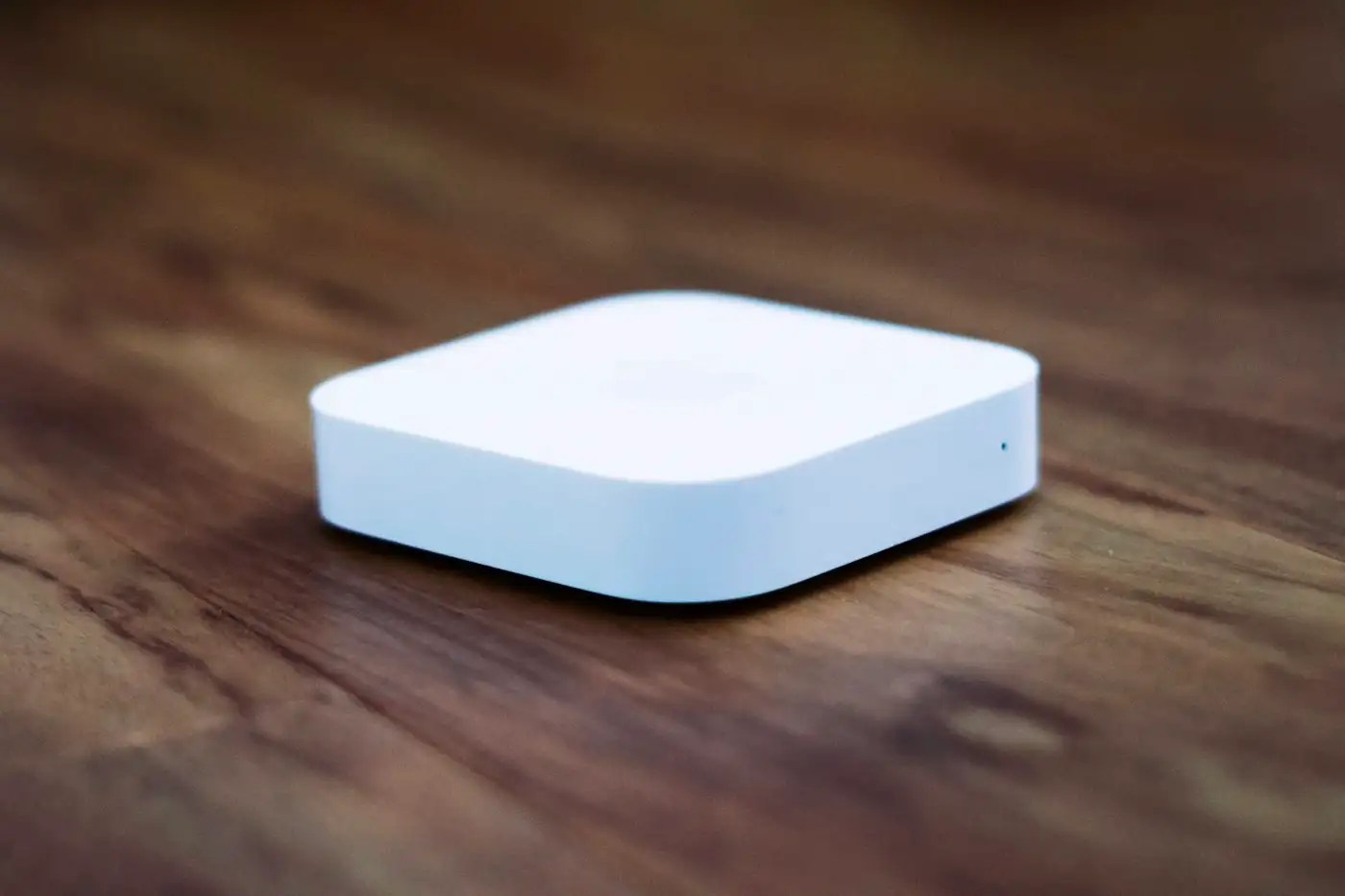 White apple tv on brown wooden table