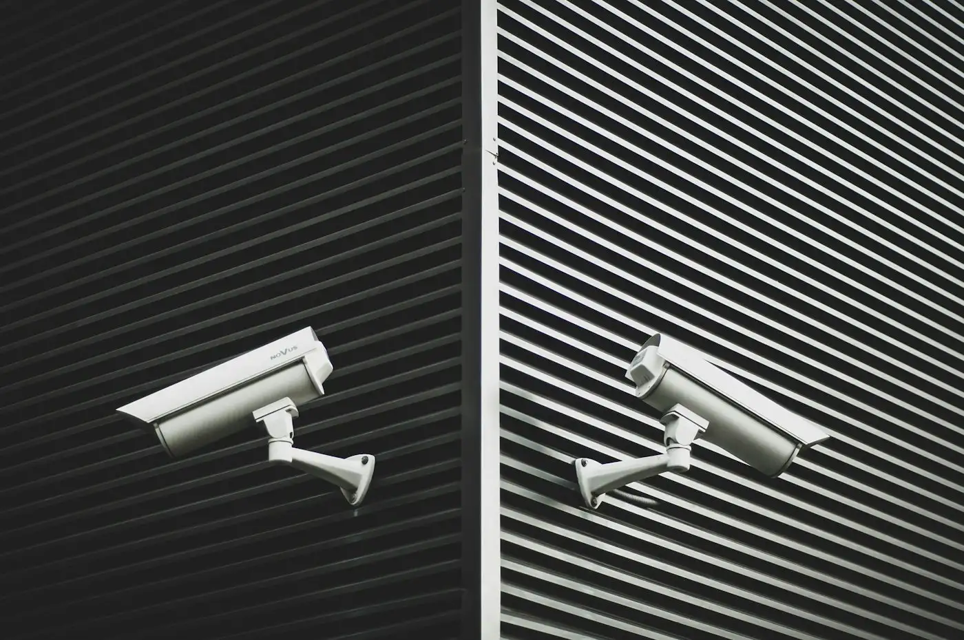 Two grey cctv cameras